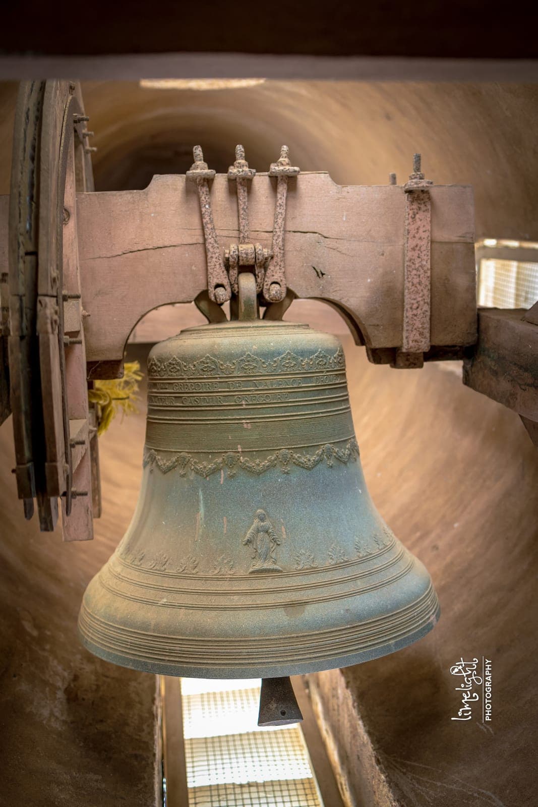 The bell in its tower, cast “Vve Grégoire de Valence (Drôme) — Donateur Casimir Grégoire”
